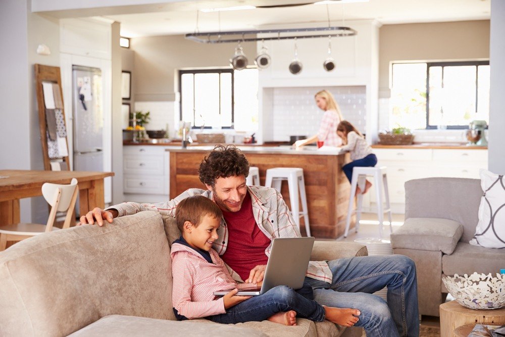 Family together in a great room and kitchen